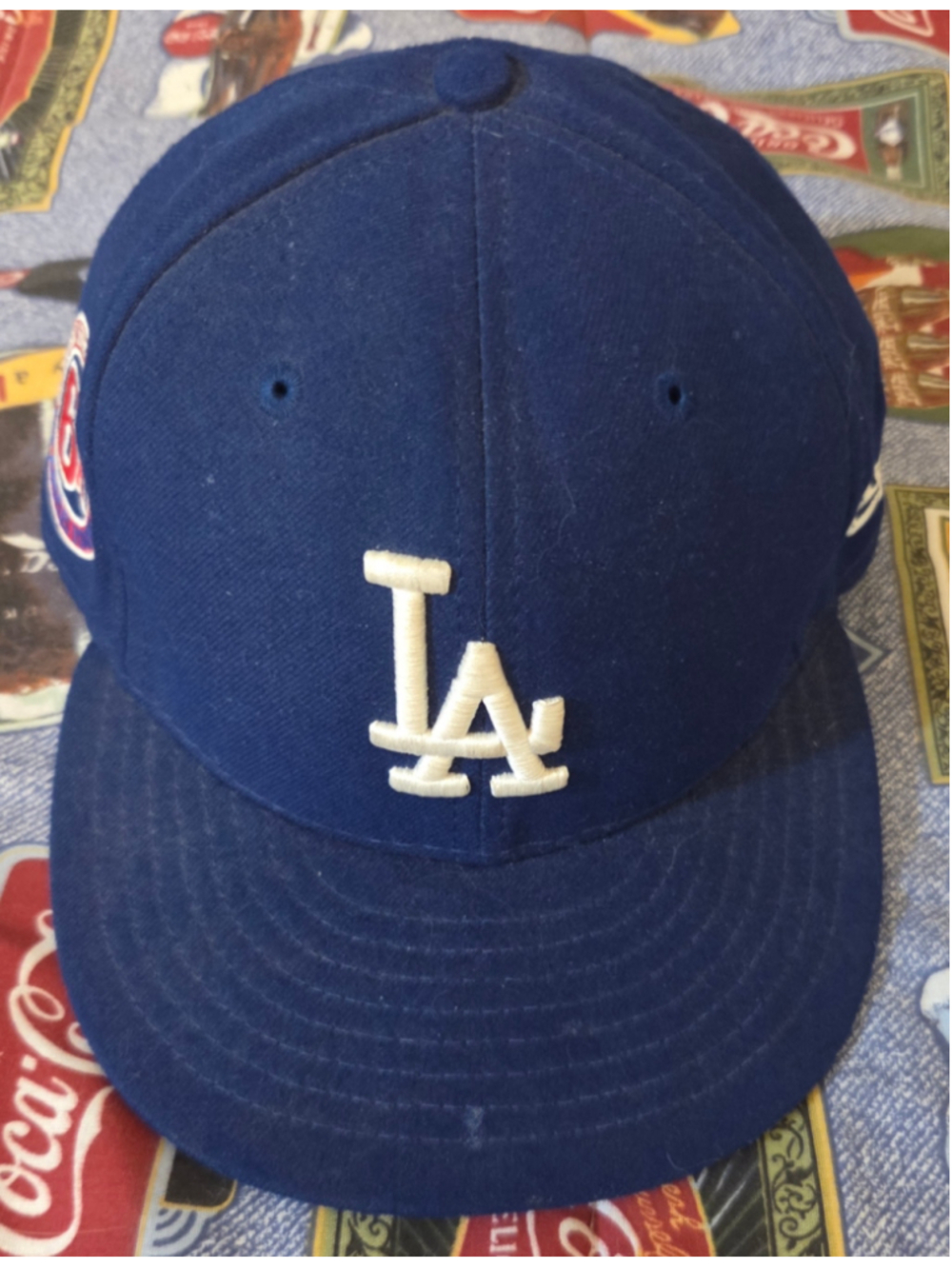 Baseball cap by New Era. Royal blue crown and visor with a raised w